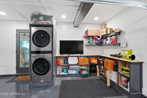 an aerial view of a house with a yard lake view