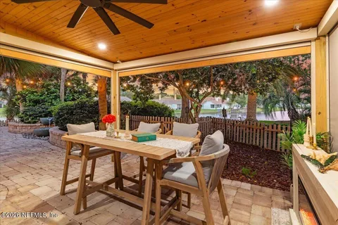 an aerial view of a house with a lake view