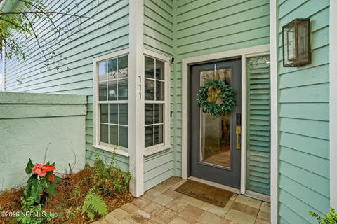 a kitchen with cabinets and window