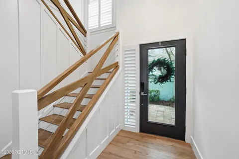 a dining room with a window and chairs
