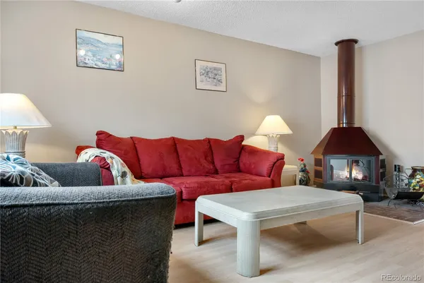 a bedroom with a bed and a table