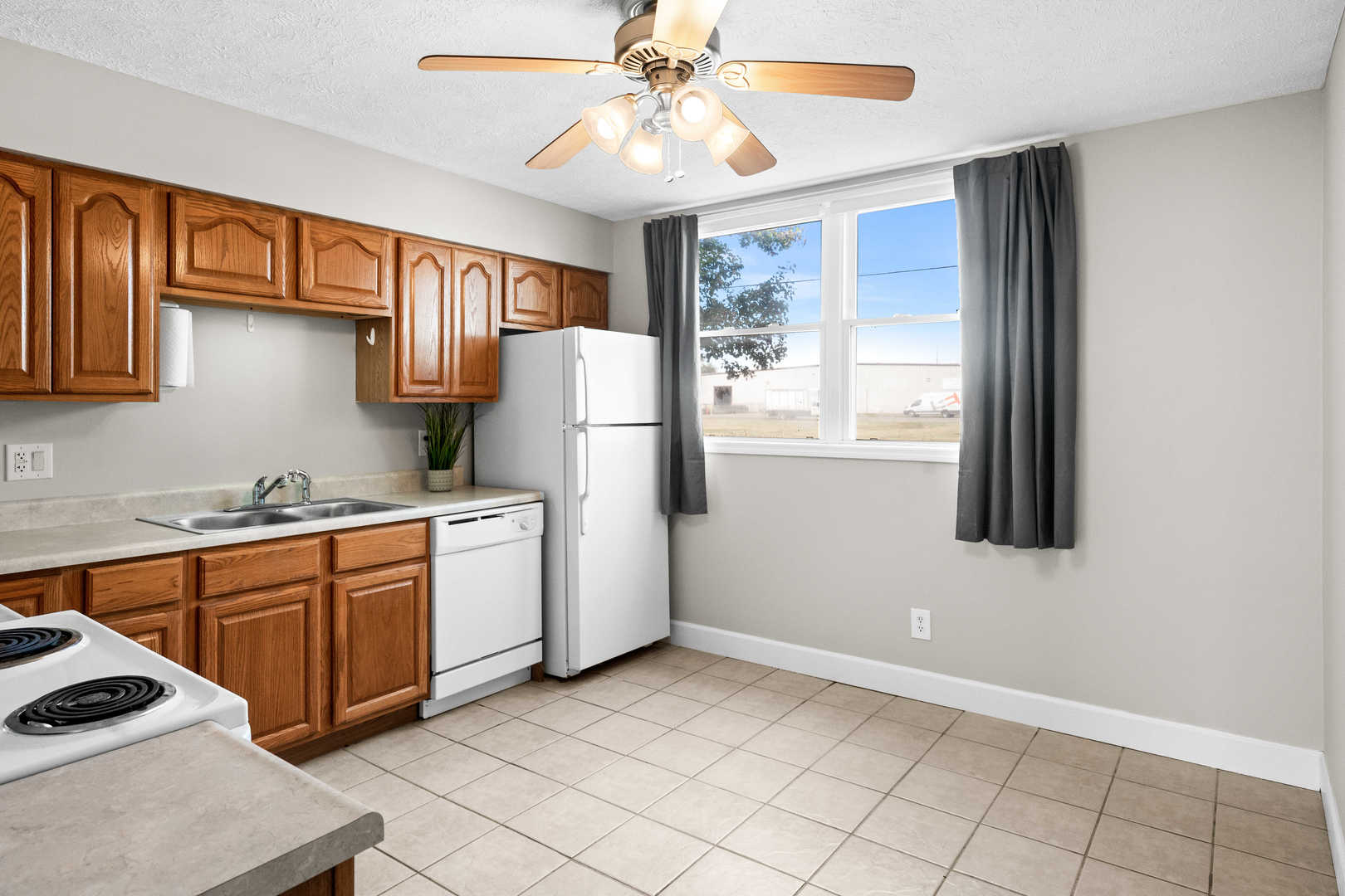10 Willedrob Road, Unit 26 Bloomington, IL 61701 - Photo 4 of 10 a kitchen with a refrigerator and a sink