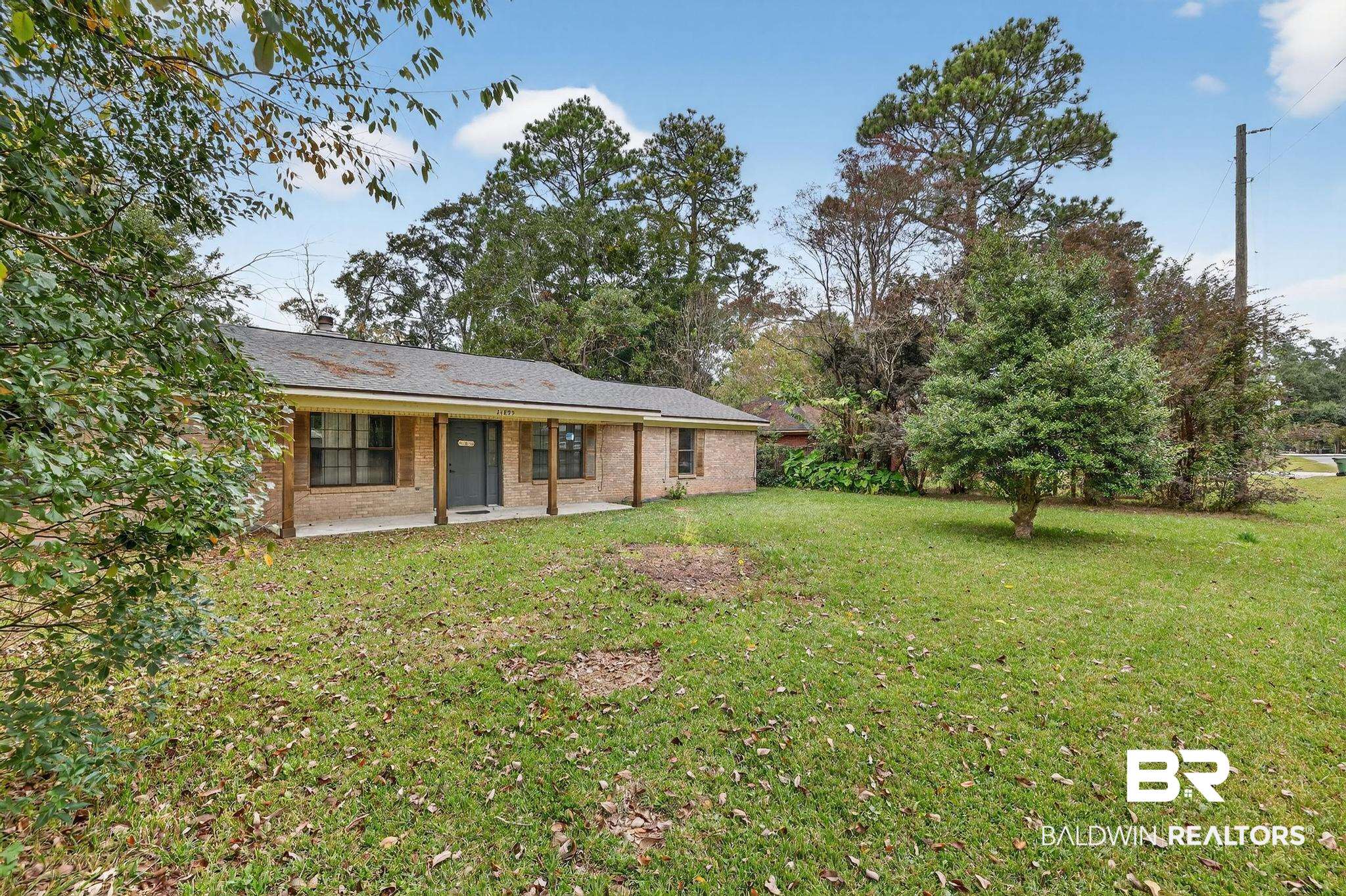 21895 2nd Street Silverhill, AL 36576 - Photo 7 of 43 Front view of house with a lawn and brick siding