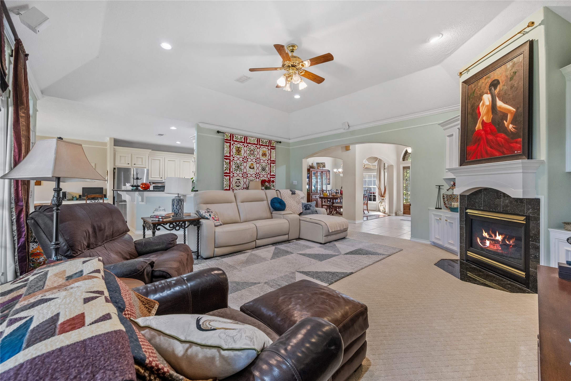 319 Palais Verde Road Montgomery, TX 77356 - Photo 11 of 39 a living room with furniture a fireplace and a flat screen tv