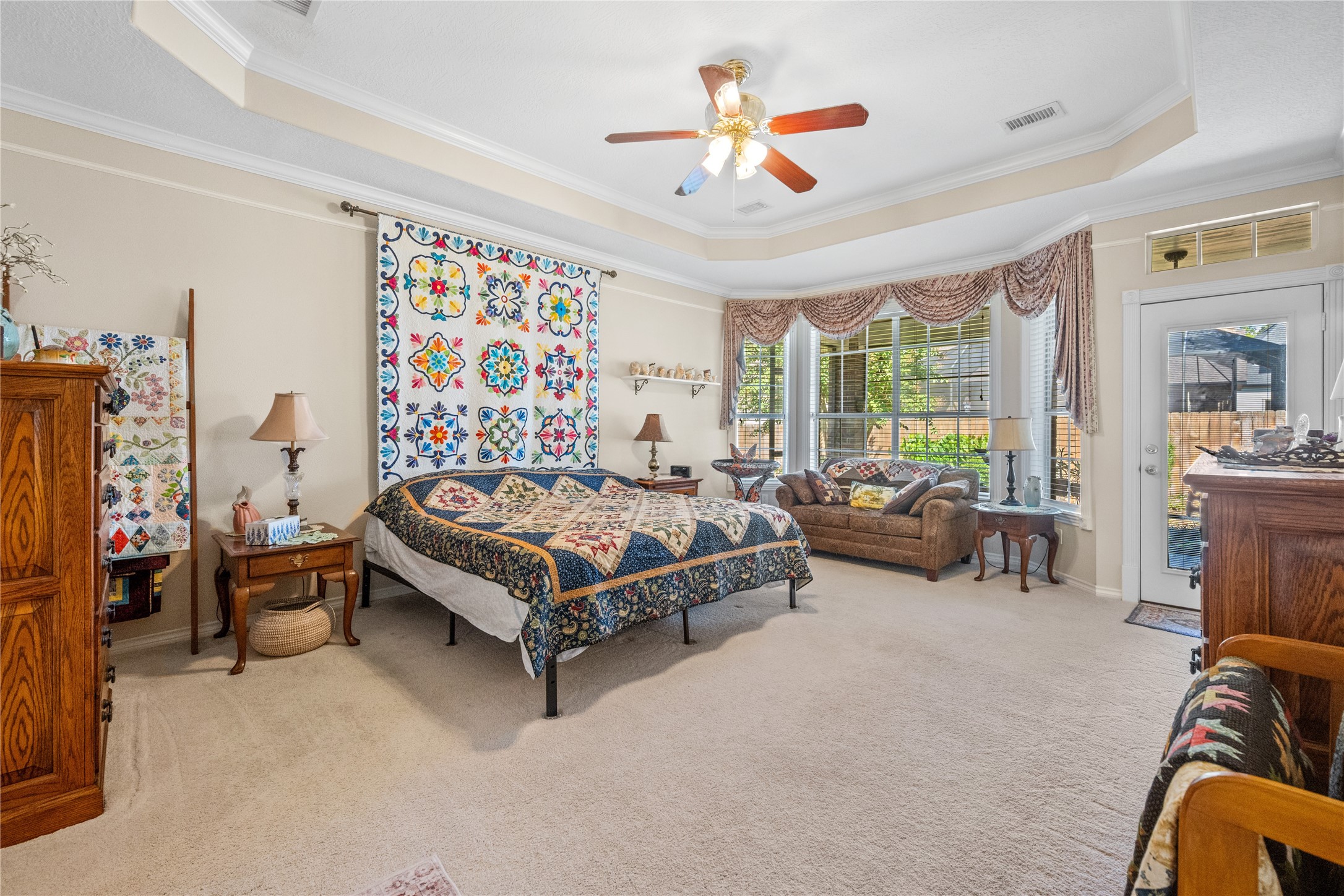 319 Palais Verde Road Montgomery, TX 77356 - Photo 16 of 39 a spacious bedroom with a bed and a chandelier