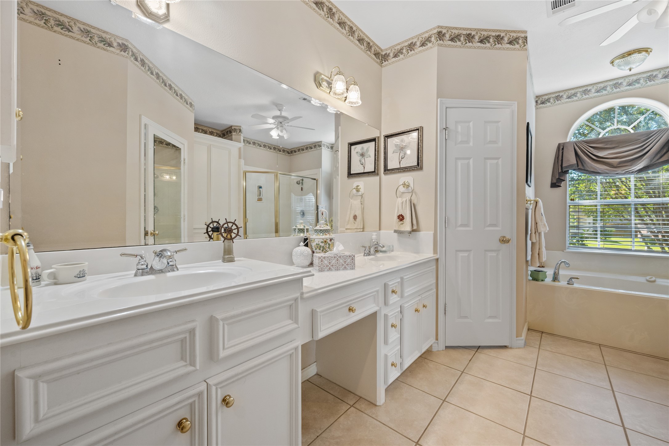 319 Palais Verde Road Montgomery, TX 77356 - Photo 18 of 39 a spacious bathroom with a granite countertop sink a toilet and a mirror