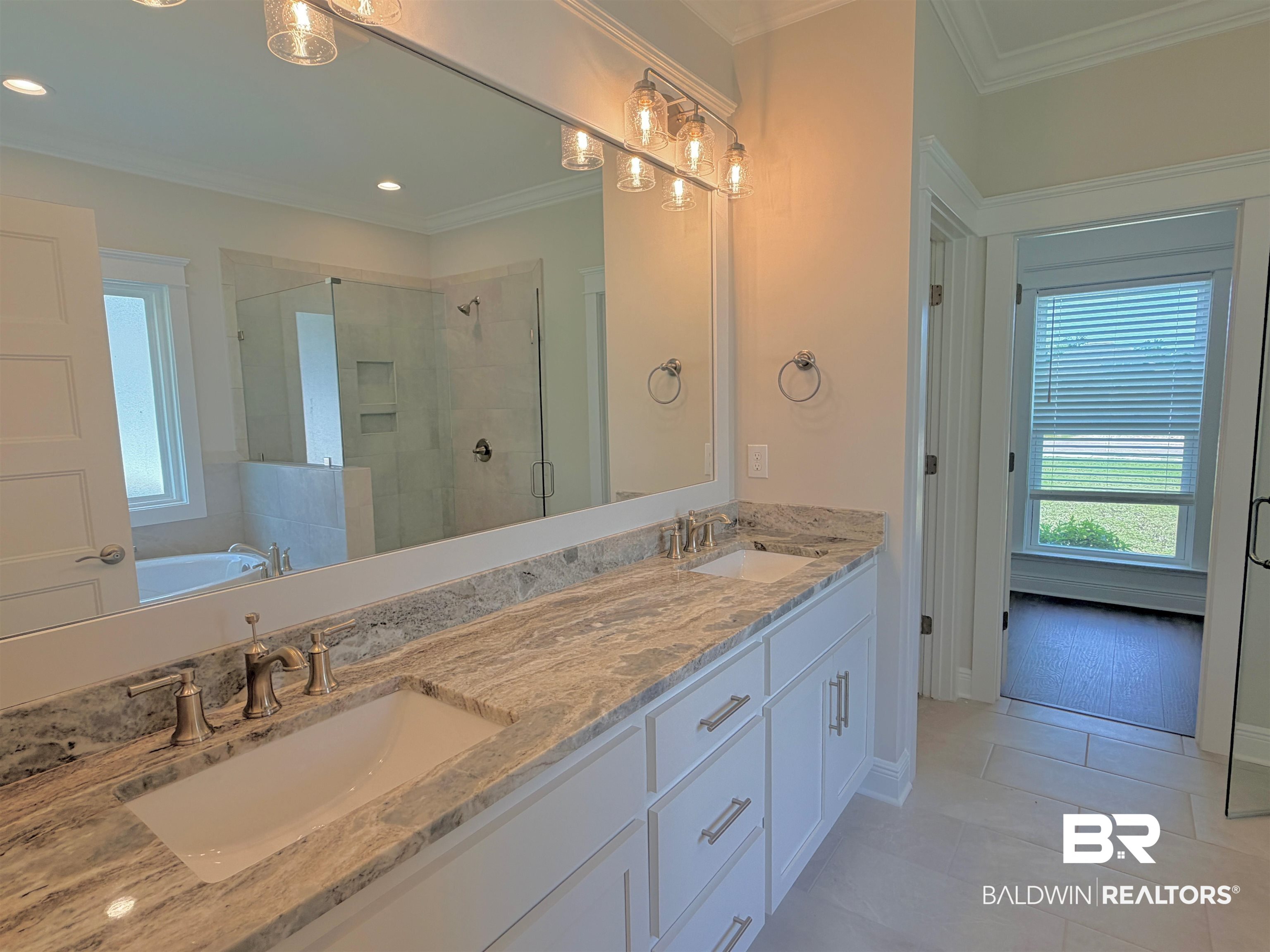 318 Morning Mist Way Fairhope, AL 36532 - Photo 7 of 20 Double vanity with undermount sinks, stone countertop, and brushed nickel fixtures