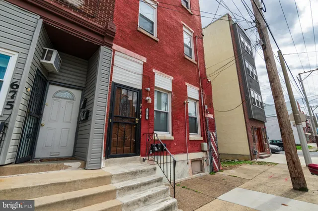 a view of a brick building with many windows