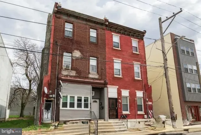 a front view of a building with street view