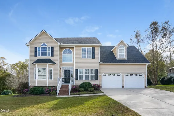 front view of a house with a yard