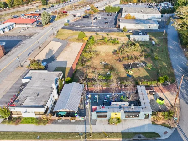 an aerial view of residential houses and outdoor space