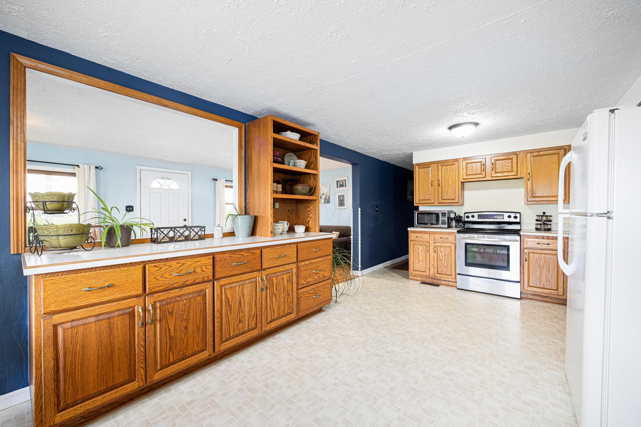 12913 Fladt Road Marysville, OH 43040 - Photo 20 of 73 Kitchen view into living room and hall to bedrooms