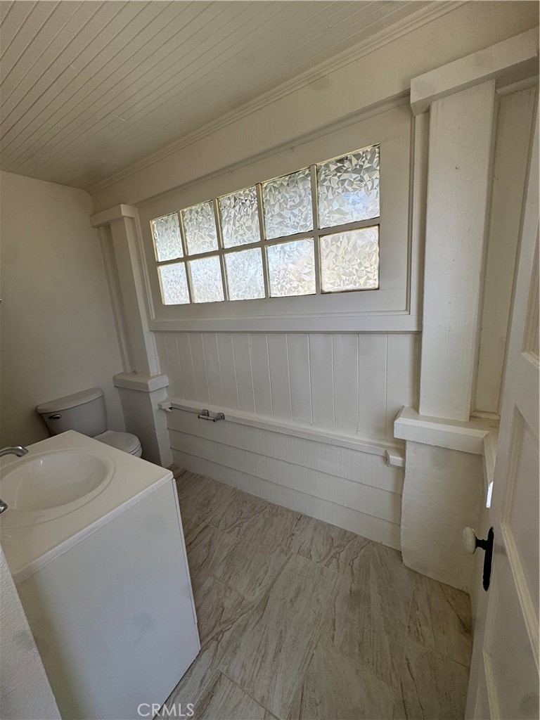 4478 4th Street Riverside, CA 92501 - Photo 20 of 51 a bathroom with a sink and bathtub with toilet