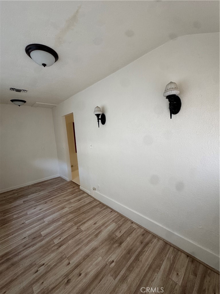 4478 4th Street Riverside, CA 92501 - Photo 31 of 51 a view of an empty room with wooden floor