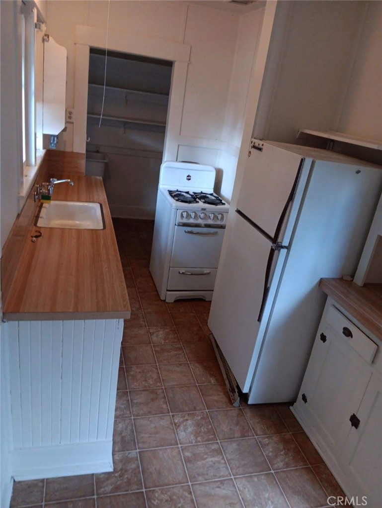 4478 4th Street Riverside, CA 92501 - Photo 44 of 51 a view of walk in closet with clothes and shoes