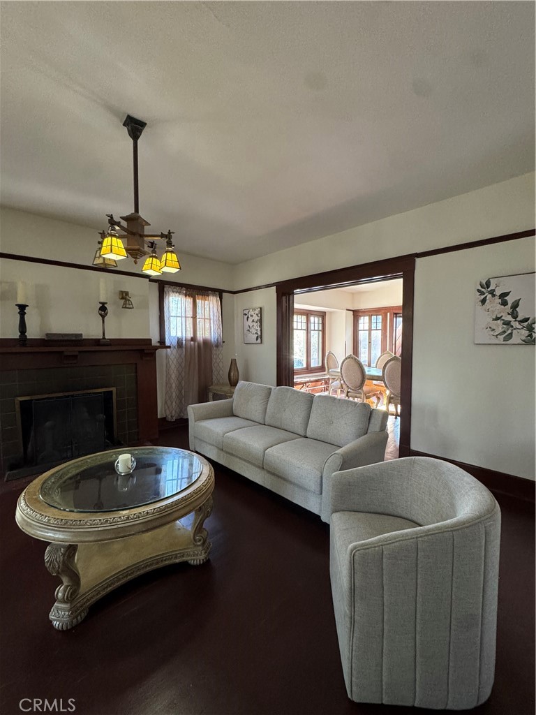 4478 4th Street Riverside, CA 92501 - Photo 6 of 51 a living room with furniture and a chandelier