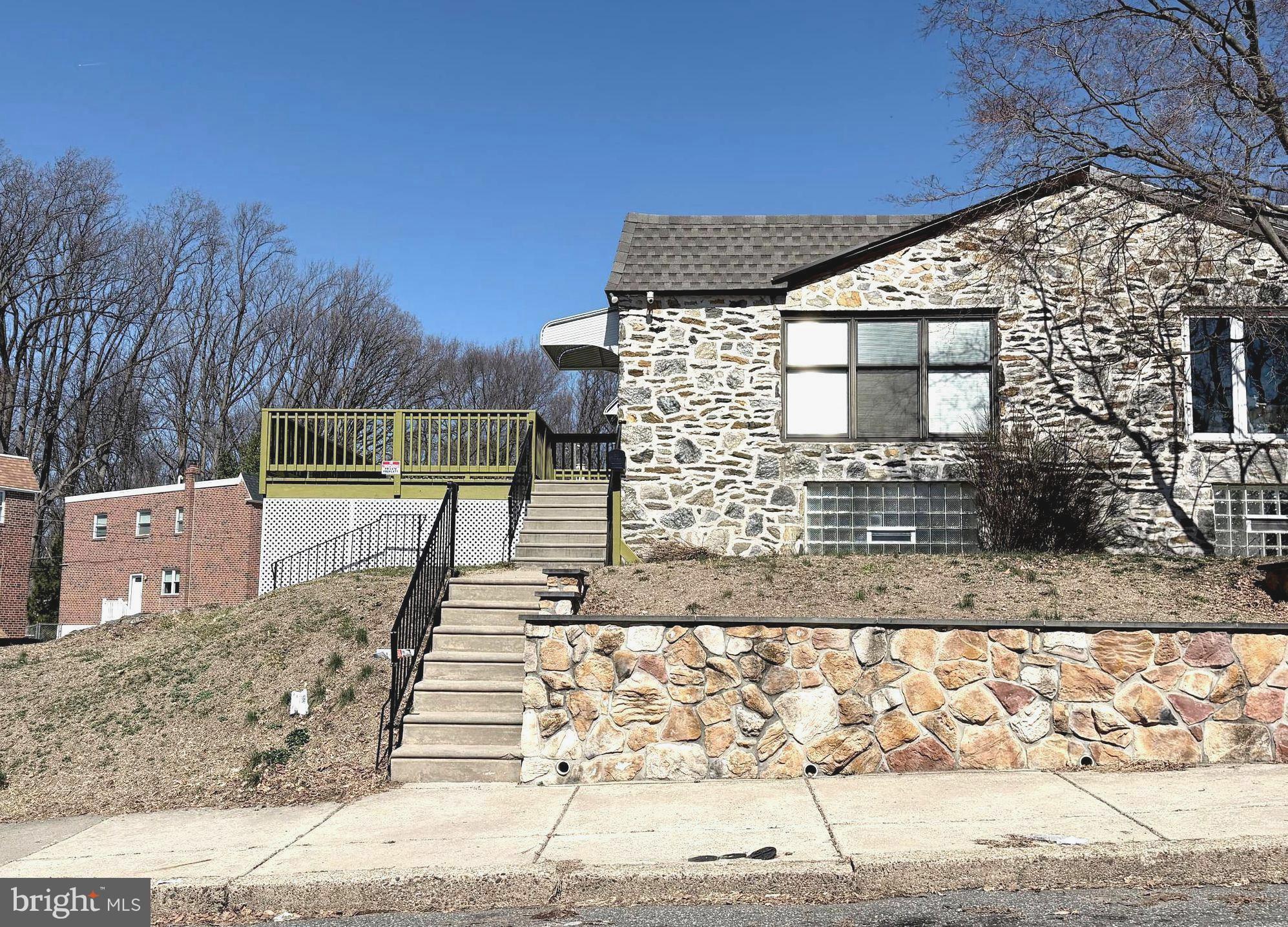 a view of a brick building next to a yard