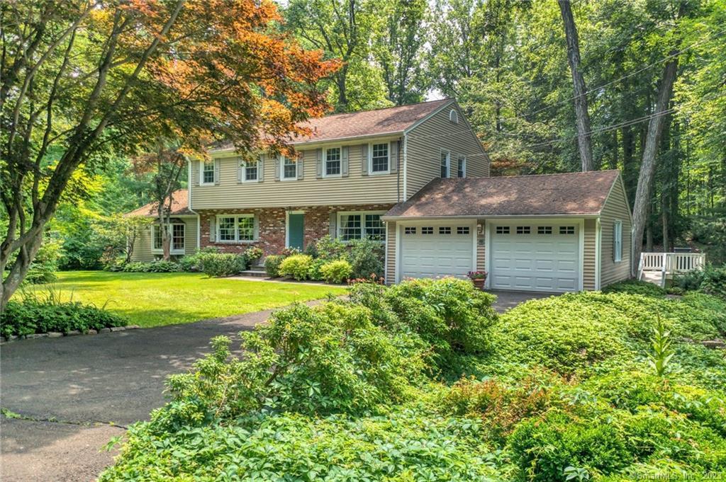9 Poplar Road Ridgefield, CT 06877 - Photo 1 of 1 a view of a house with a swimming pool