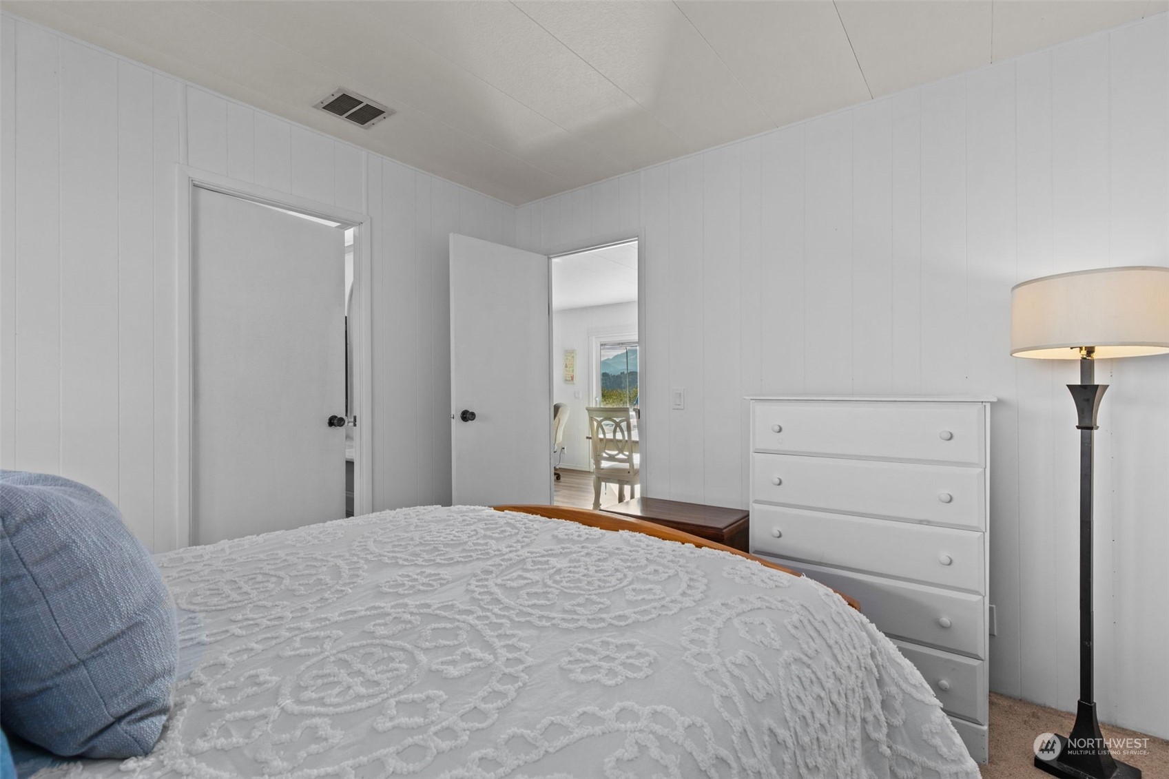 13909 Prairie Ridge Drive East Bonney Lake, WA 98391 - Photo 15 of 36 a bedroom with a bed and a lamp