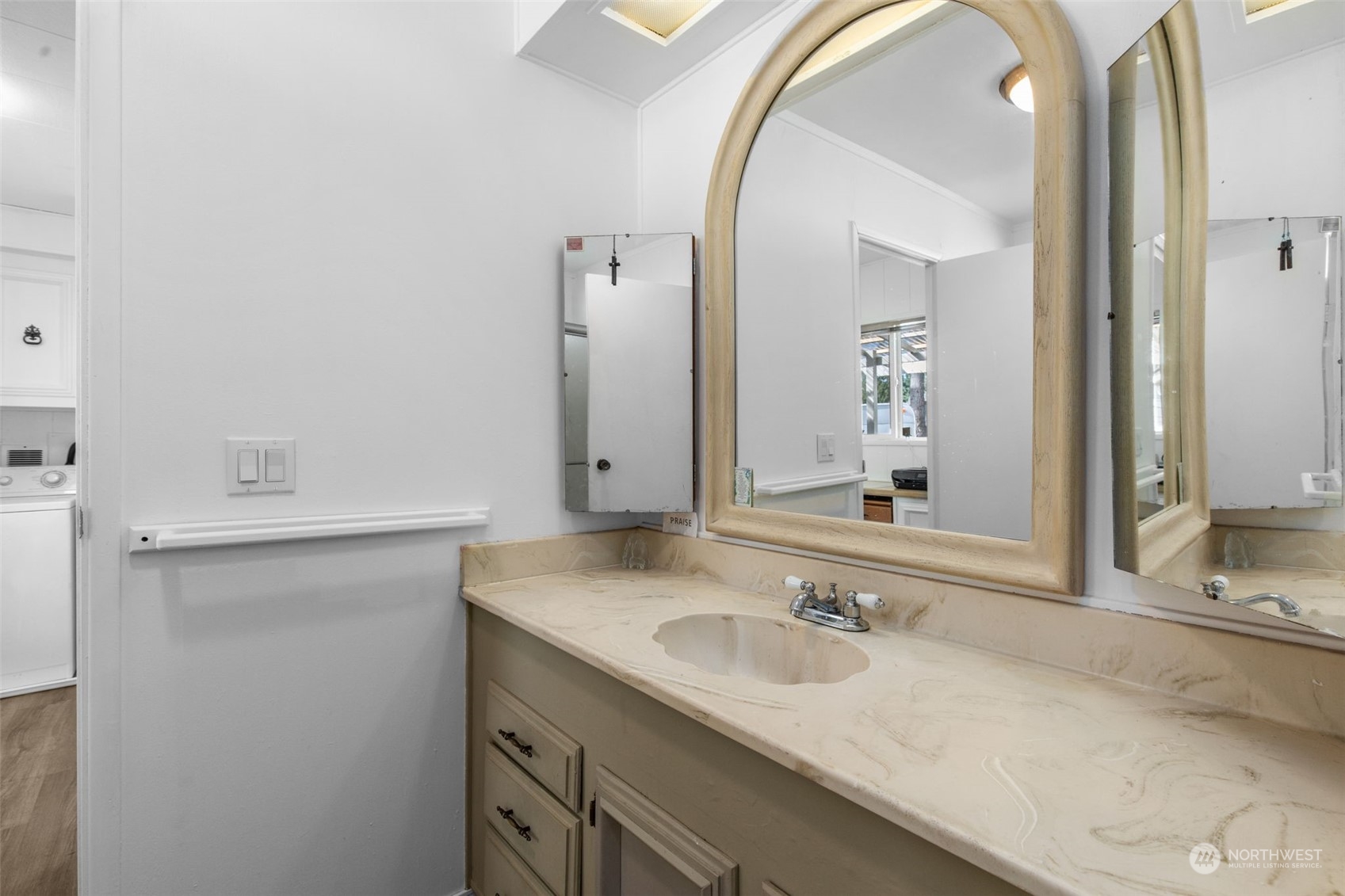 13909 Prairie Ridge Drive East Bonney Lake, WA 98391 - Photo 16 of 36 a bathroom with a granite countertop sink and a mirror