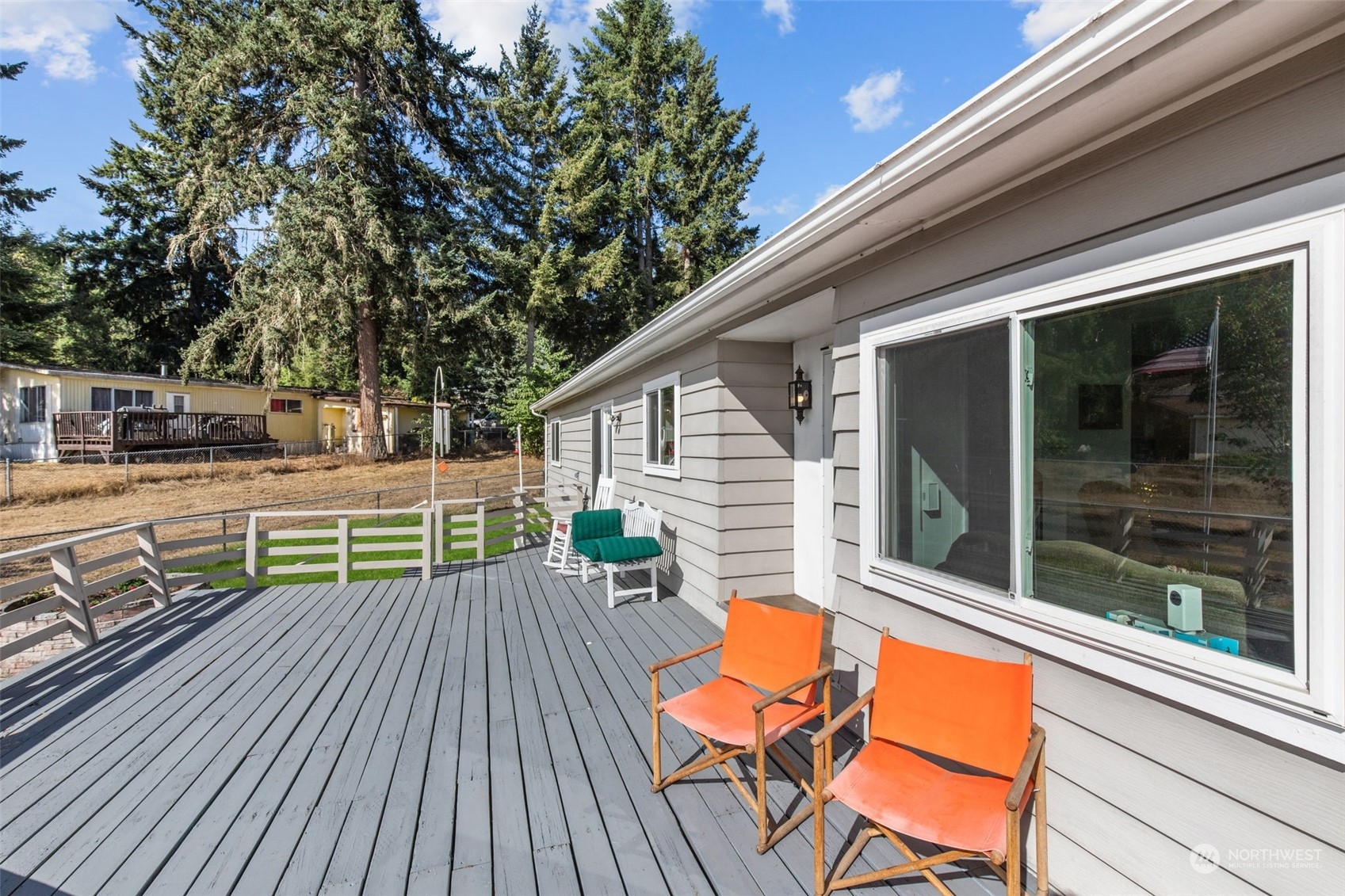 13909 Prairie Ridge Drive East Bonney Lake, WA 98391 - Photo 20 of 36 a view of house with deck and outdoor seating