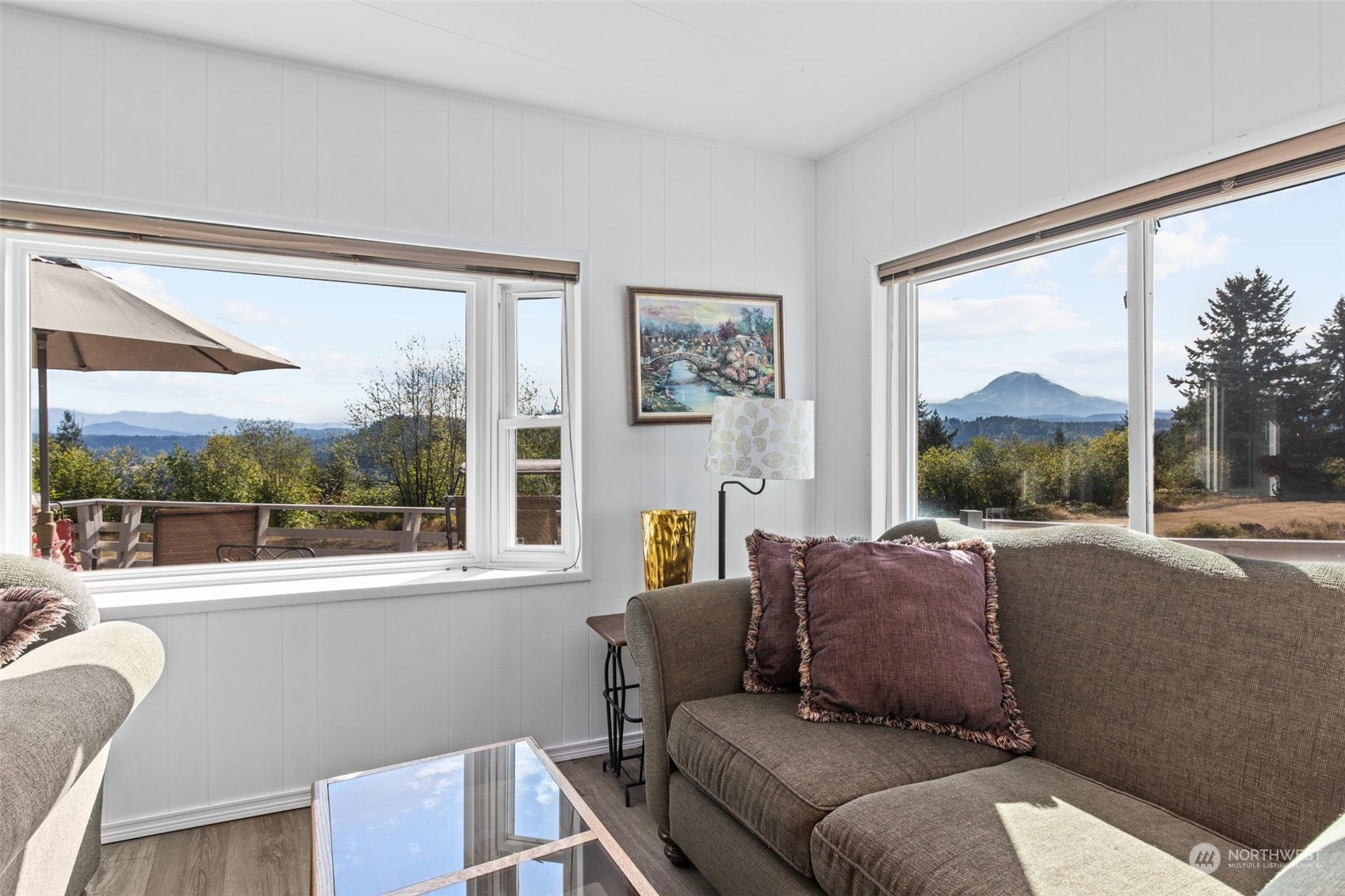 13909 Prairie Ridge Drive East Bonney Lake, WA 98391 - Photo 6 of 36 a living room with a couch and a window