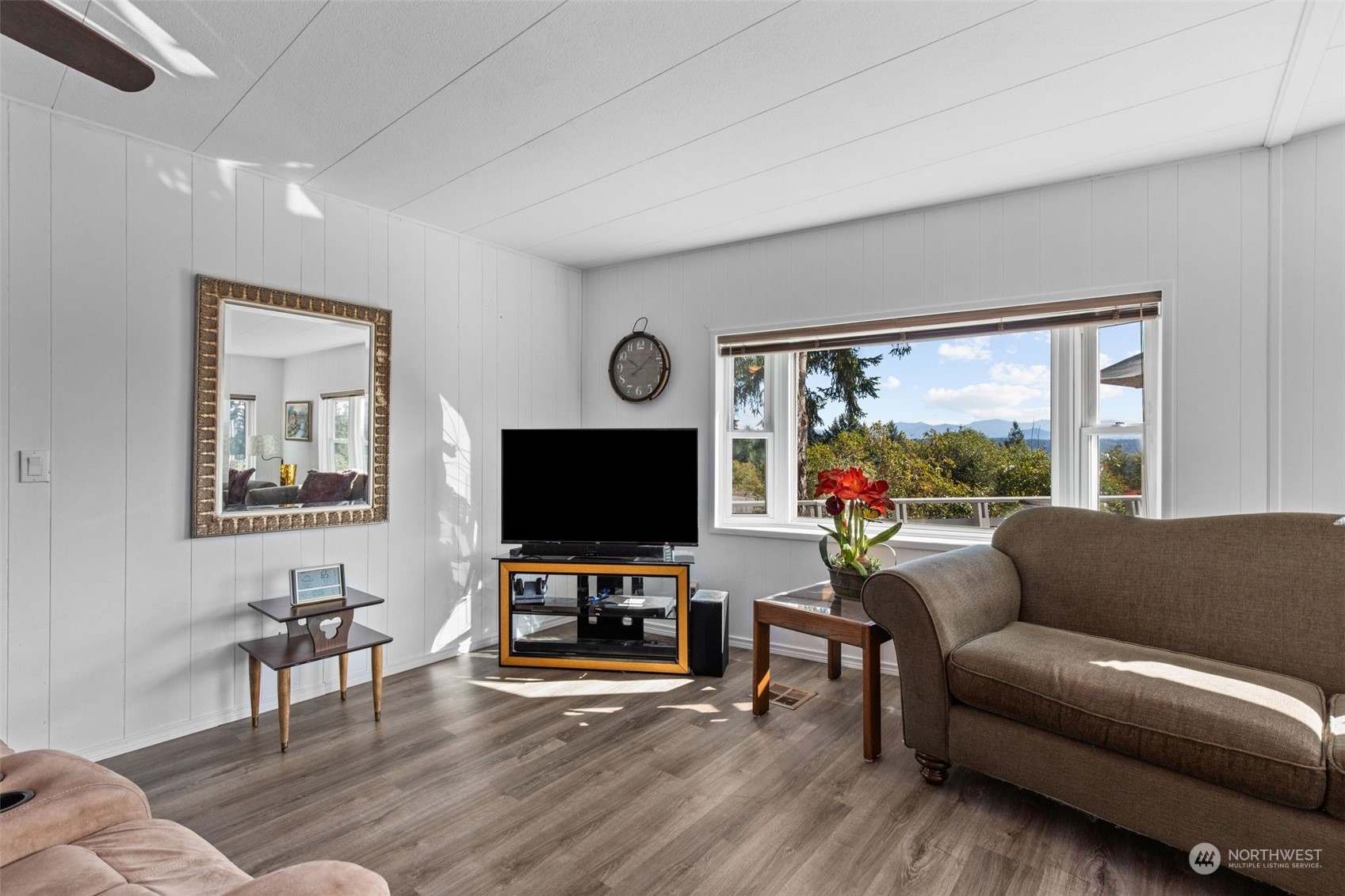13909 Prairie Ridge Drive East Bonney Lake, WA 98391 - Photo 7 of 36 a living room with furniture and a flat screen tv