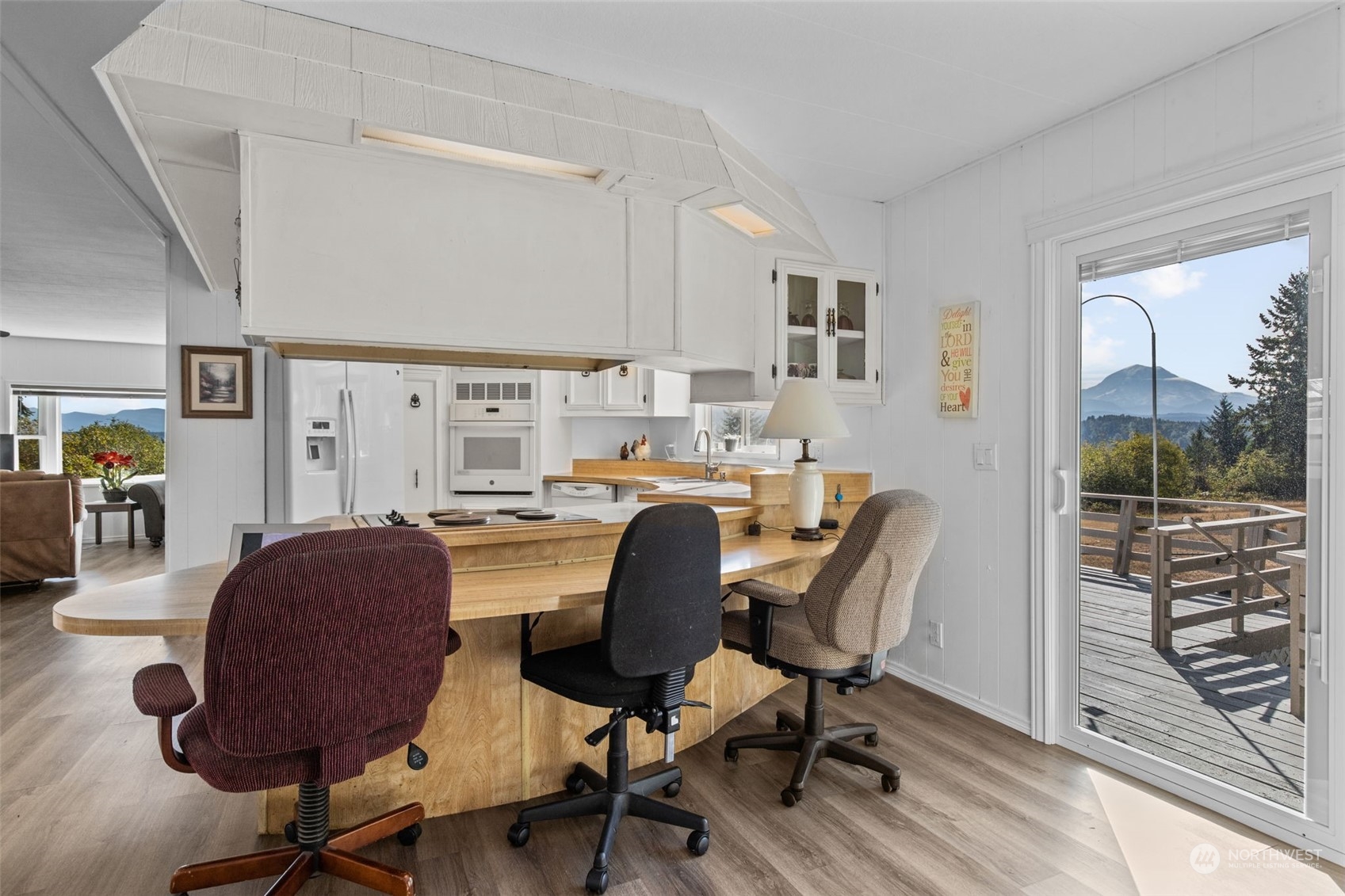 13909 Prairie Ridge Drive East Bonney Lake, WA 98391 - Photo 9 of 36 a workspace with wooden floor and furniture