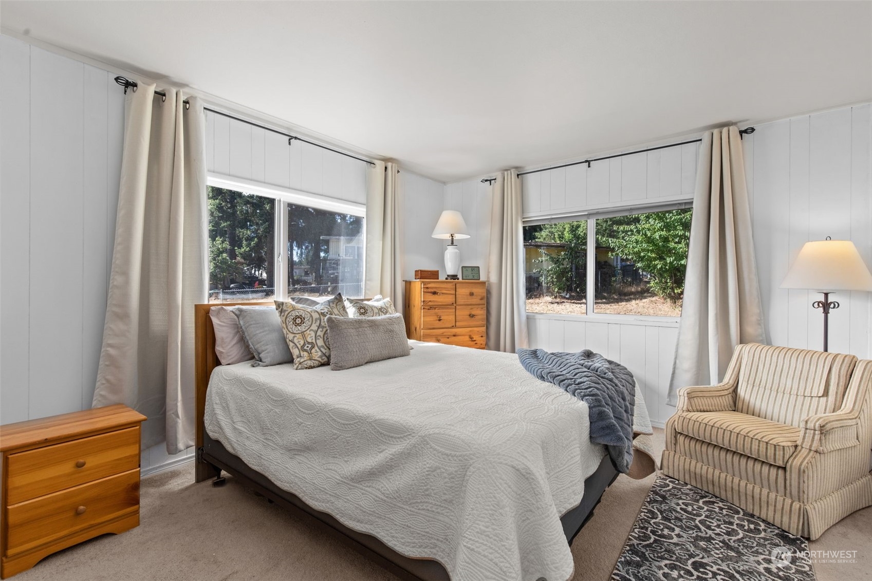 13909 Prairie Ridge Drive East Bonney Lake, WA 98391 - Photo 10 of 36 a bedroom with a bed and large window