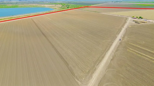 a view of a lake and a yard