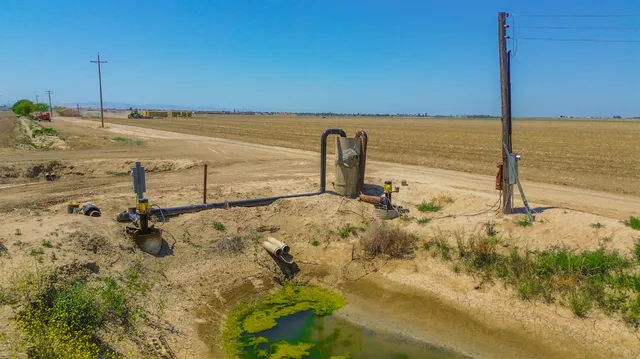 a view of a gallery with wooden floor