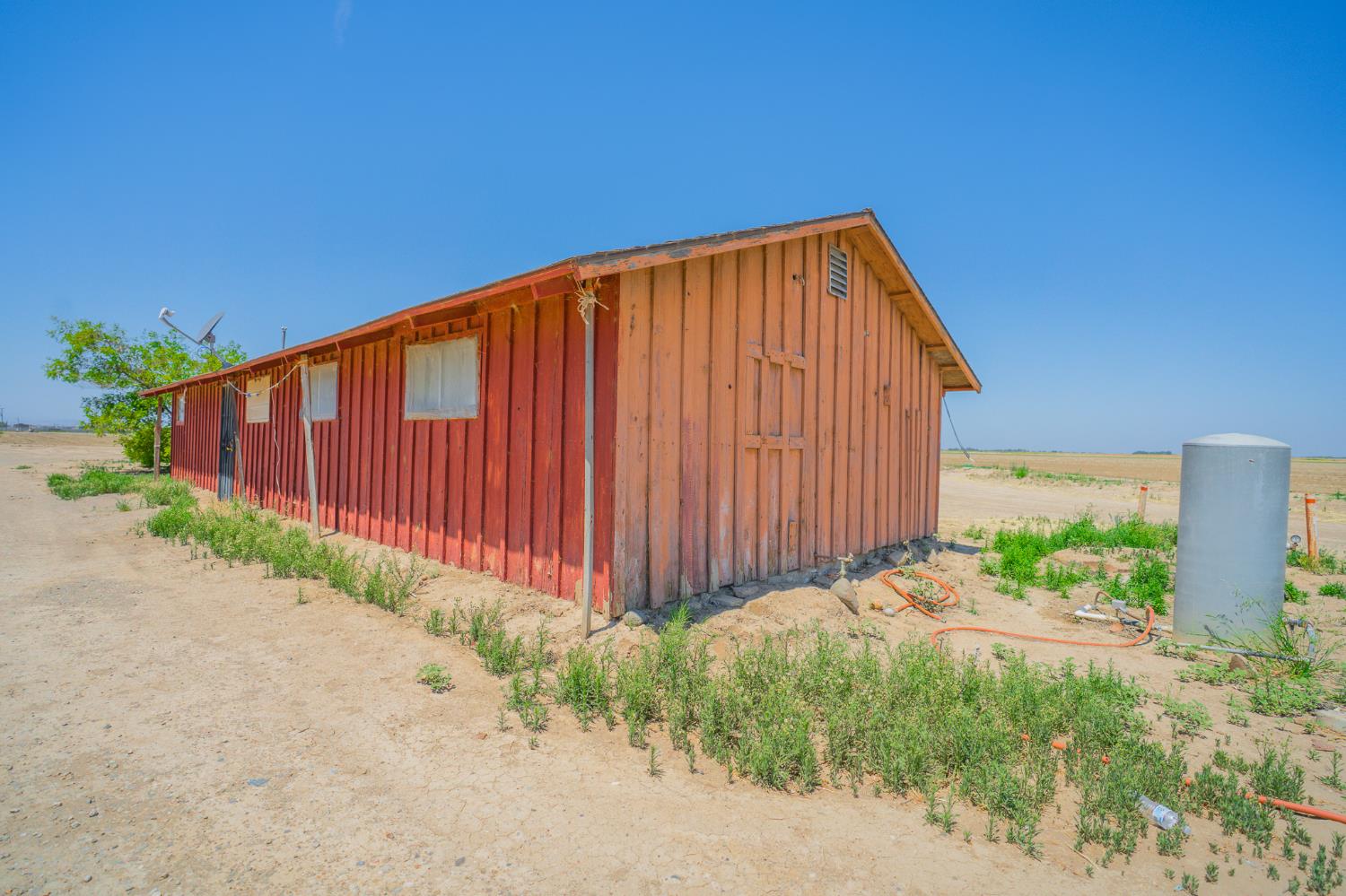 0 Santa Fe Grade Los Banos, CA 93635 - Photo 38 of 50 a view of a backyard with potted plants and a wooden fence