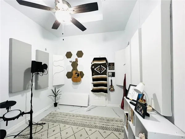 a view of living room with furniture and rug