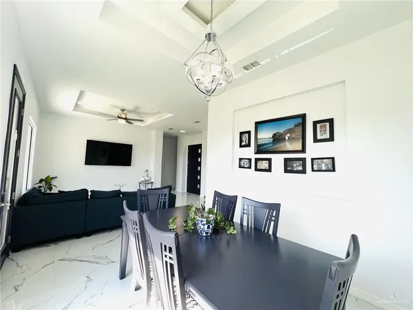 a view of a dining room with furniture and a table