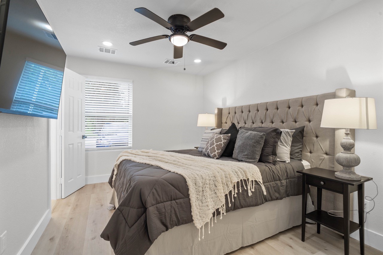 3138 Sunbeam Street Houston, TX 77051 - Photo 29 of 50 Relax and recharge in this tranquil primary suite featuring soft neutral tones, designer touches, and a warm, inviting atmosphere.