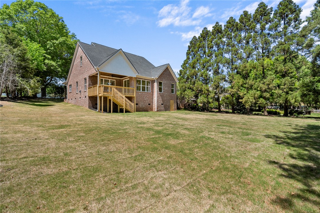 100 Garden Gate Drive Anderson, SC 29621 - Photo 38 of 43 This spacious brick home features a deck and a large yard, perfect for outdoor living.
