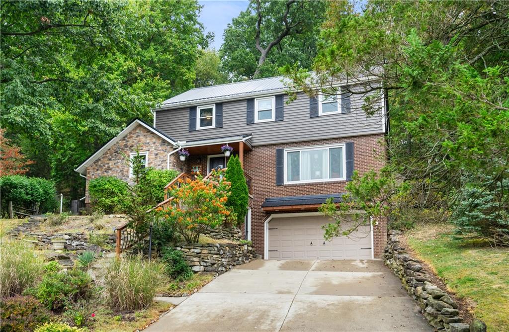 127 Berwyn Road Pittsburgh, PA 15237 - Photo 1 of 29 a front view of a house with a garden