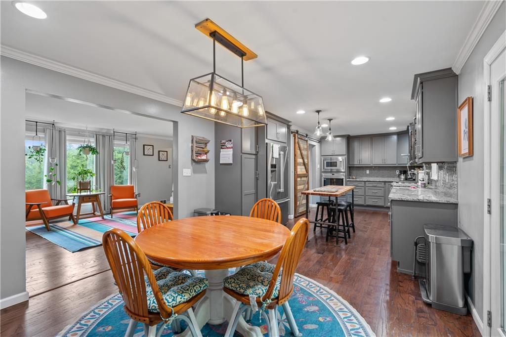 127 Berwyn Road Pittsburgh, PA 15237 - Photo 15 of 29 a dining room with furniture a chandelier and wooden floor