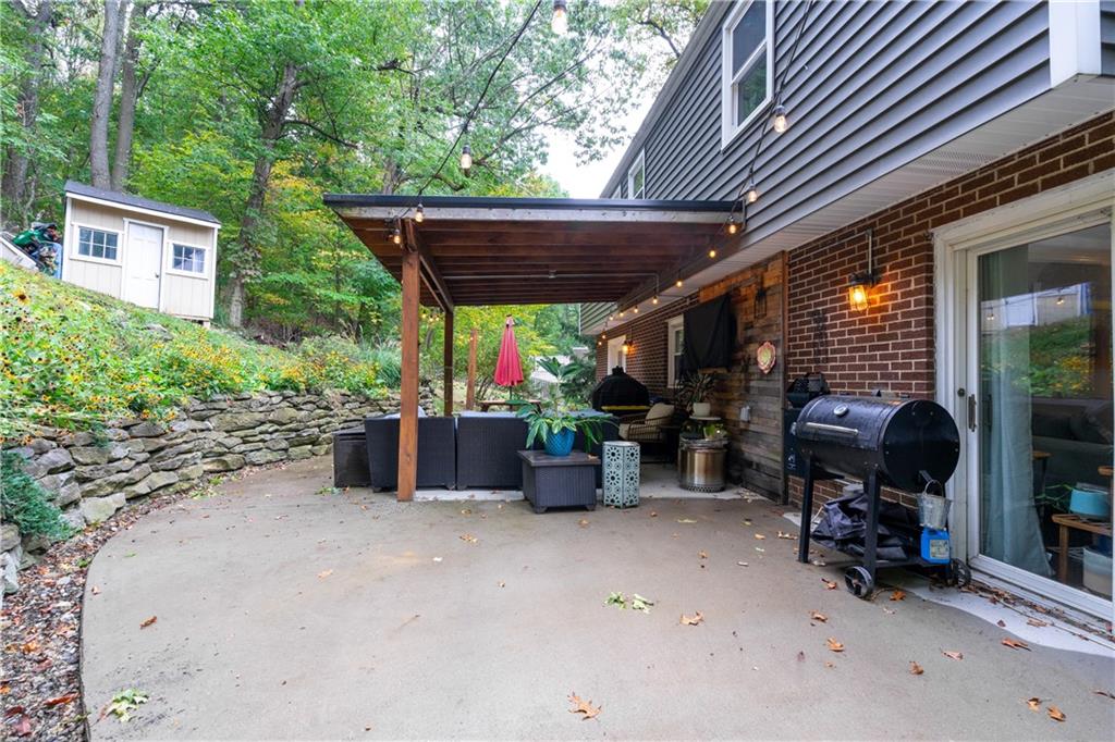127 Berwyn Road Pittsburgh, PA 15237 - Photo 26 of 29 a view of a patio with table and chairs potted plants