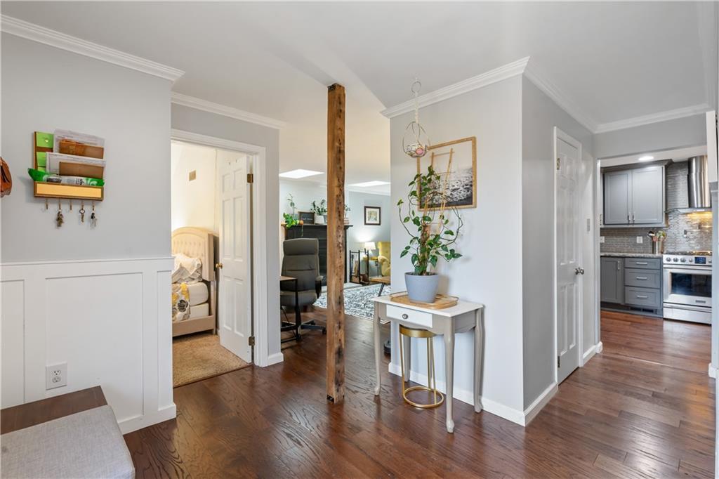 127 Berwyn Road Pittsburgh, PA 15237 - Photo 8 of 29 a view of a hallway with wooden floor and a living room