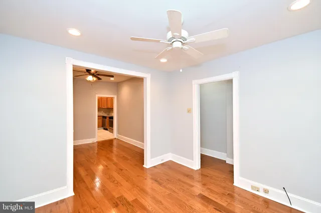 a view of an empty room and wooden floor