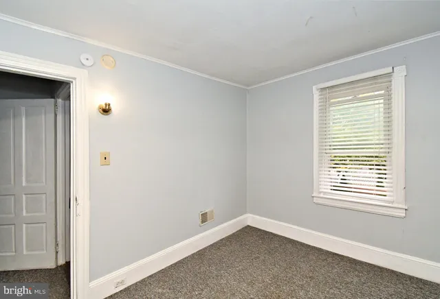 a view of a room that has a window in it