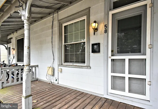 a view of a house with wooden floor and windows