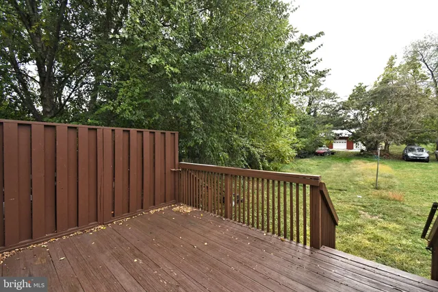 a view of wooden house and a large window