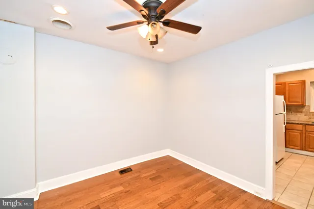 a view of a room with a wooden floor