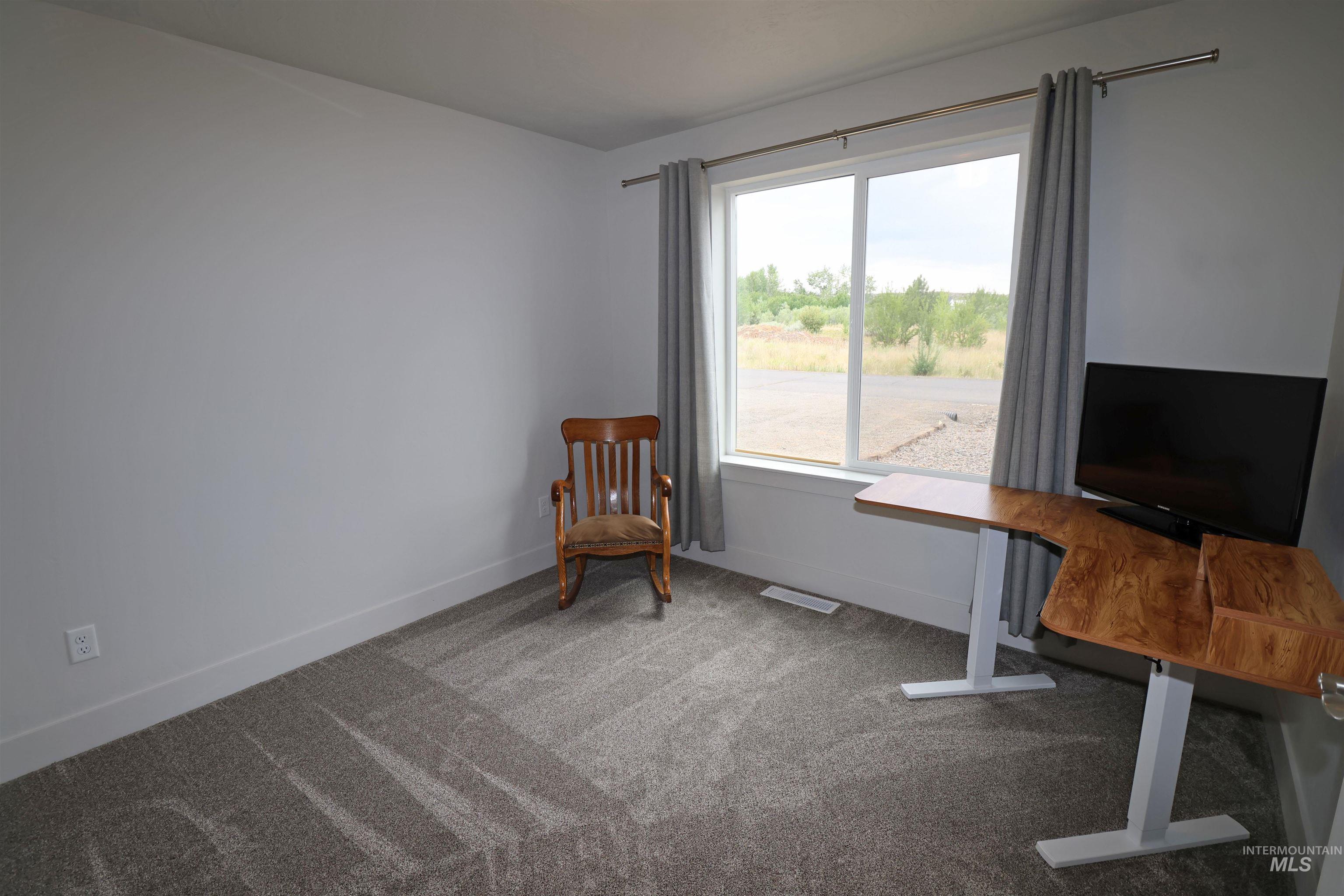 2272 Golf Lane Council, ID 83612 - Photo 21 of 32 Office area with carpet flooring and baseboards