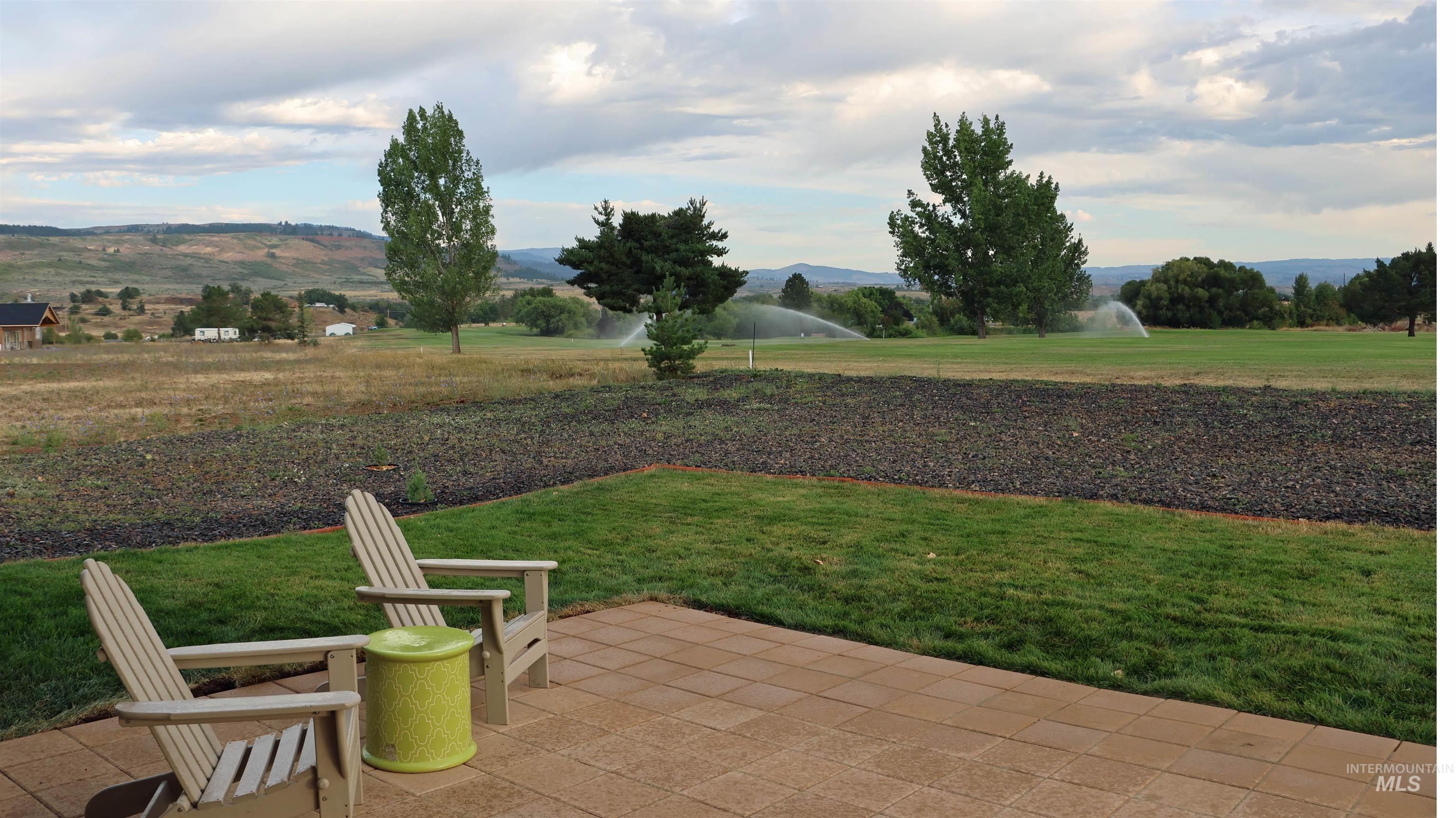 2272 Golf Lane Council, ID 83612 - Photo 5 of 32 View of grassy yard with a patio area and a mountain view