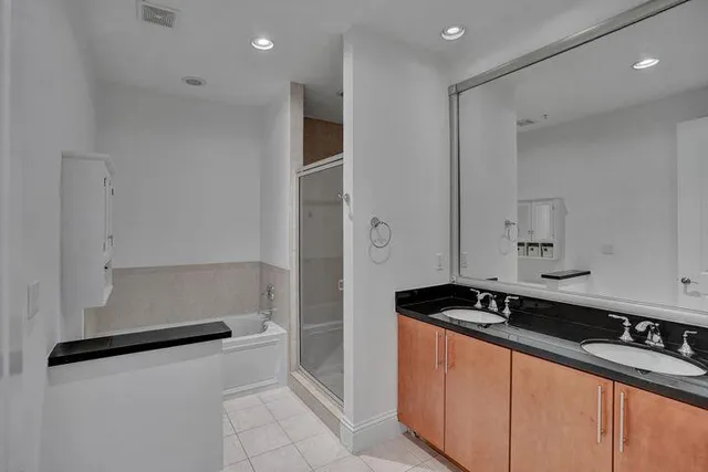 a kitchen with granite countertop a sink and a stove top oven