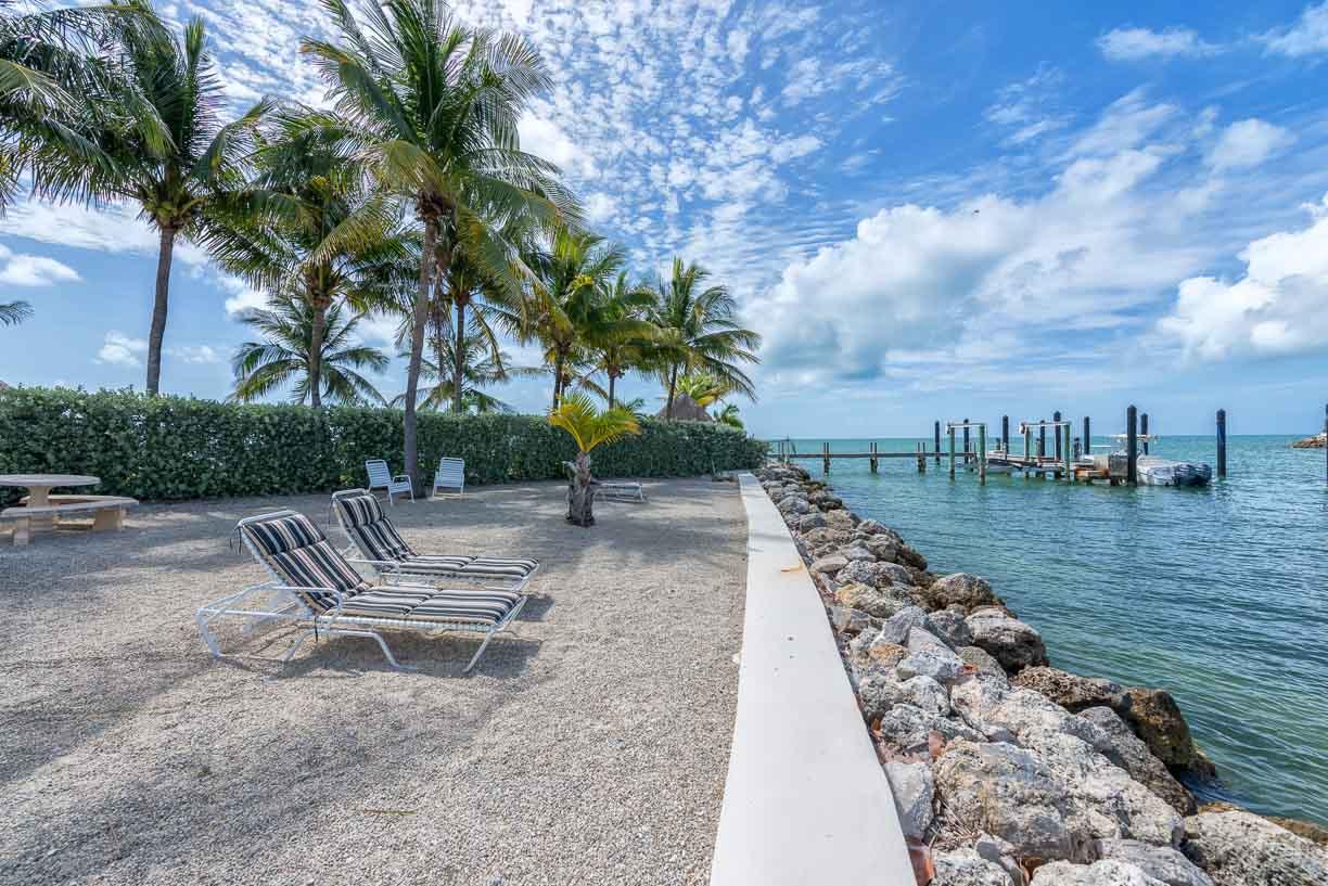 2000 Coco Plum Drive, Unit 404 Marathon, FL 33050 - Photo 19 of 23 a view of outdoor space with lake view