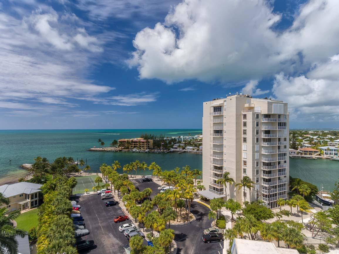 2000 Coco Plum Drive, Unit 404 Marathon, FL 33050 - Photo 21 of 23 a view of a lake with a city in the back